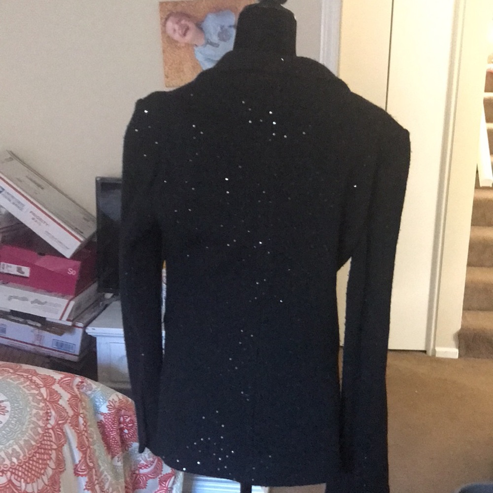 This a cute sparkly black wool mix jacket which add zing to your wardrobe.